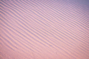 Ripples in the sand background texture 