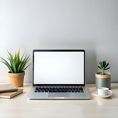 Fototapeta premium A modern minimalist workspace with a laptop. plants. and a cup of coffee.