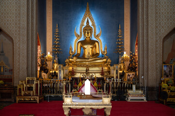 Thailand, August 11, 2024, Wat Benchamabophit Dusitwanaram, A serene golden Buddha statue beautifully illuminated in a traditional temple setting during midday