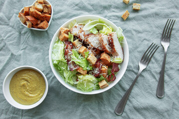 A bowl  of  Caesar salad