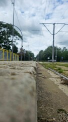 Railway Platform Edge Under Cloudy Sky
