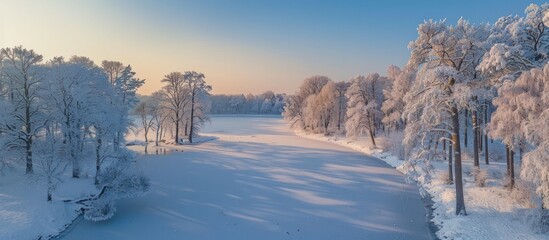 Obraz premium Breathtaking Drone Captured Timelapse of a Frozen Lake with Snow Covered Trees at Twilight in a Pristine Winter Landscape The Peaceful