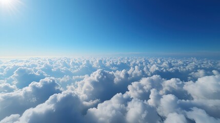 A serene view of fluffy white clouds against a bright blue sky, evoking feelings of peace and tranquility.