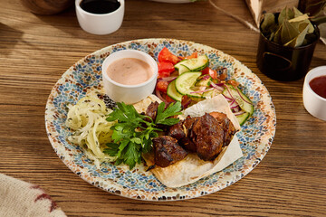 Grilled Shashlik with Fresh Vegetables and Onion on Rustic Plate