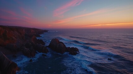 Obraz premium Stunning drone timelapse capturing the breathtaking transformation of a rocky coastline at dawn