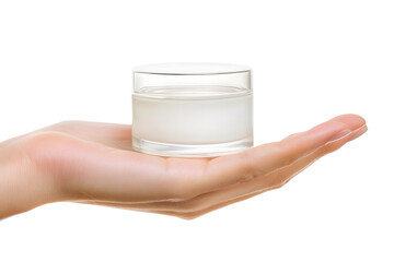 Close-up Female hand holding white mockup glass jar of face cream isolated on white background. Beauty products, skin care, nutrition and hydration concept