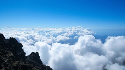 Fototapeta premium High-altitude clouds viewed from a mountain peak