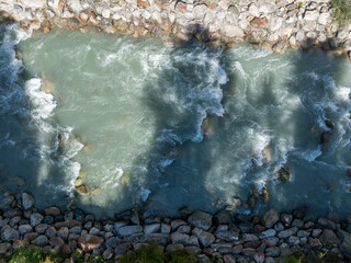 Aerial view of rapids in river.