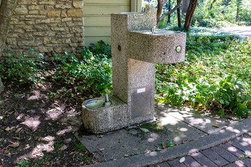 Muti tiered water fountain for humans and pets in a park in summer 