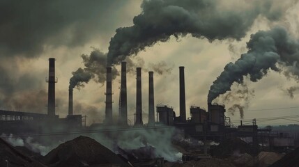 Billowing smokestacks loom over an industrial landscape under a gloomy sky, casting a somber and impactful ambiance.