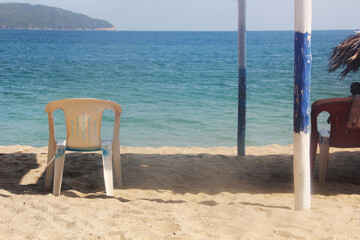 Palapa en el mar, silla