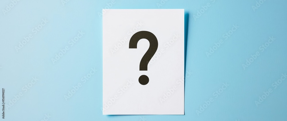 Poster an inset of a question mark on a panoramic blue background is shown on this note paper