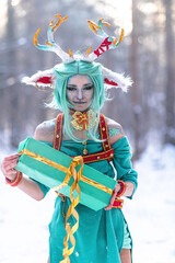 Obraz premium Christmas deer girl looking for gifts for Santa in winter in the forest