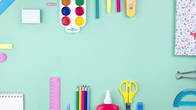 Looped school of office stop motion animation, layout table back to school concept. Stationery composition, Pastel colors flat lay