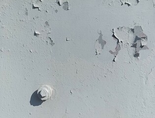 White (shades of grey) gloomy wall with cracked plaster (different shapes) and bolt with shadow in the lower left corner. Good for collages, backdrops or other works. Photo. Industrial.
