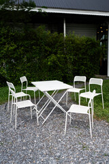 Set of white chair and table in garden patio home