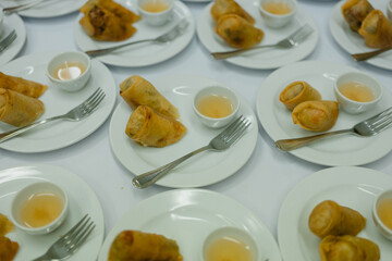 Fried spring rolls with sweet chili sauce for coffee break at a seminar at the hotel