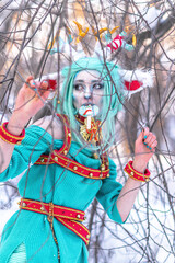 Christmas deer girl looking for gifts for Santa in winter in the forest