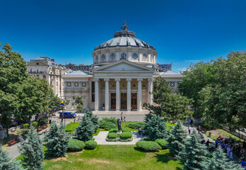 Obraz premium Romanian Atheneum in Bucharest. Aerial view of this amazing landmark historical building from Bucharest, Romania, on Victoriei Avenue (Calea Victoriei). Travel to Romania.