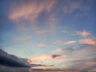 A clear blue sky with a few clouds. The sky is so clear that it almost looks like a painting