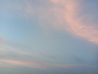 A clear blue sky with a few clouds. The sky is so clear that it almost looks like a painting