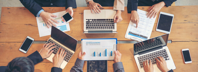 Group of People working together with laptop on wooden office desk.Professional business team...