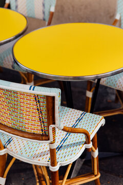Yellow and teal French caf&eacute; chair