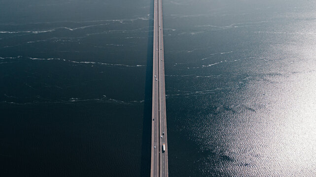 Aerial View of Long Bridge Over Expansive Body of Water
