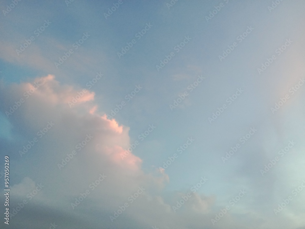 Wall mural a clear blue sky with a few clouds. the sky is so clear that it almost looks like a painting