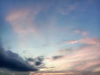 A clear blue sky with a few clouds. The sky is so clear that it almost looks like a painting
