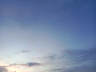 A clear blue sky with a few clouds. The sky is so clear that it almost looks like a painting