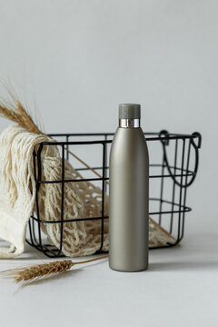 Brown bottle with cosmetics on table