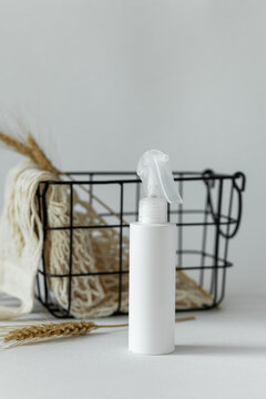 White bottle with sprayer on table