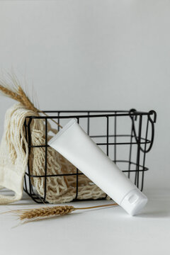 Plastic bottle with lotion on white background