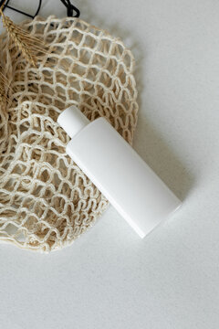 Skin care lotion in white bottle on table
