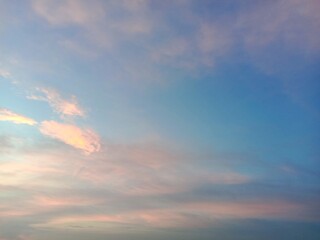 A clear blue sky with a few clouds. The sky is so clear that it almost looks like a painting