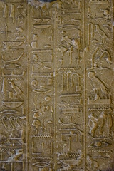 Egyptian ancient hieroglyphs on the stone wall