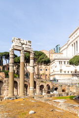 Rome, Italy - April 09, 2024: Ruins of the Roman Forum with tourists strolling among the archaeological remains in Rome, Italy