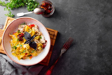  Healthy zucchini pasta with chicken and sun-dried tomatoes, top view