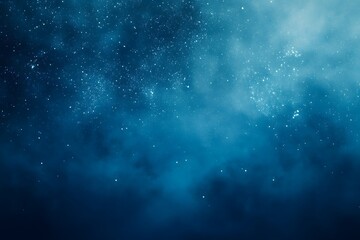 Obraz premium Abstract blue sky and star background with a soft, blurry texture. Perfect for website backgrounds