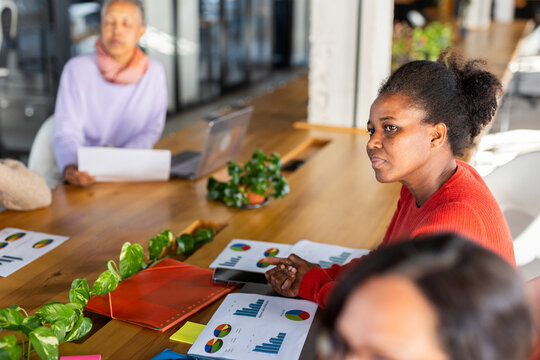 WOMAN IN A COMPANY GIVING A SALES SUMMARY