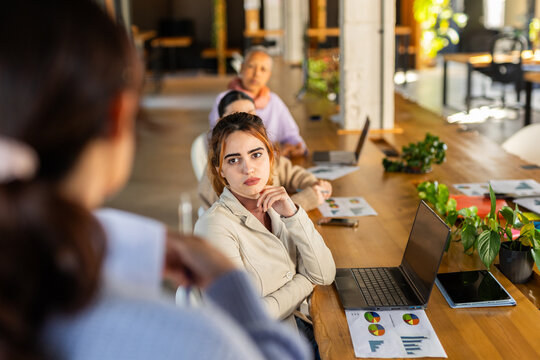 WOMAN IN A COMPANY GIVING A SALES SUMMARY