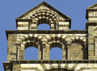 Naklejka premium Cathedral of Puy-en-Velay. 12 century. France.Detail of the left gable in the main facade