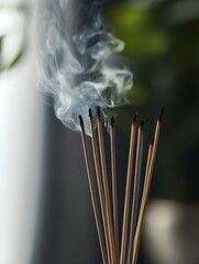 Close-up of incense sticks burning, with gentle smoke rising, capturing the essence of tranquility and sensory appeal 