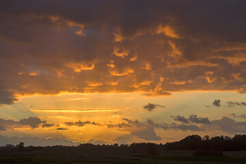 Dramatic sky over the fields. Agricultural landscape in eastern Lithuania.