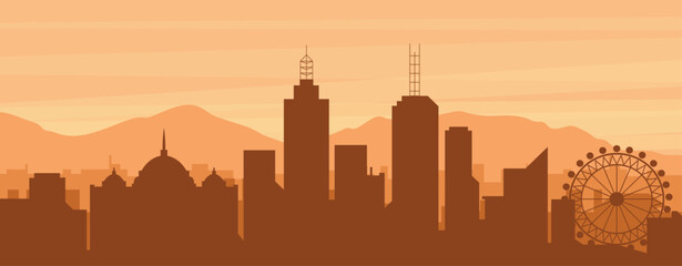 Brown panoramic poster of the city skyline with misty background buildings, sunrise, clouds and mountains of MELBOURNE, AUSTRALIA