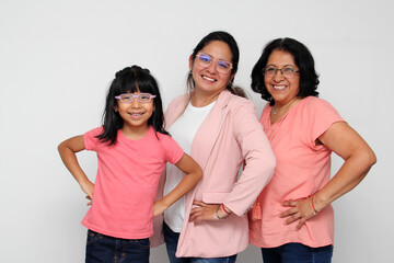 Brunette Latina grandmother, mom and daughter with glasses show their love and support together and unite to celebrate Mother's Day