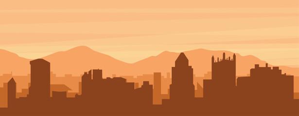 Brown panoramic poster of the city skyline with misty background buildings, sunrise, clouds and mountains of PITTSBURGH, UNITED STATES