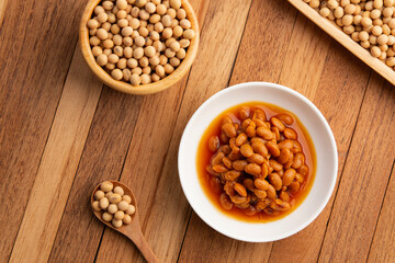salted soya beans,fermented whole soybeans in white plate.Top view.