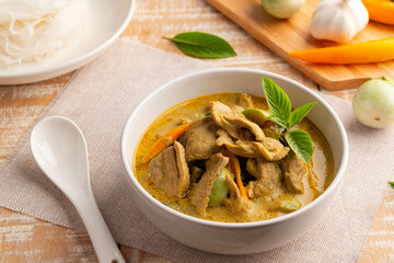 Green Curry with duck meat.Thai sliced duck breast with green curry paste and coconut milk in white bowl ,thai food ,Gaeng Kiew Wan